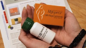 A coordinator at Massachusetts Medication Abortion Access Project shows what the medication abortion kit that is prescribed and mailed via telehealth looks like.