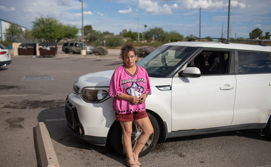 Tara Gentner stands next to the car she inherited from her mother, Sheri Petty. Petty died last summer after exposure to extreme heat. Gentner found her mother passed out on the floor of their manufactured home in sweltering July temperatures.