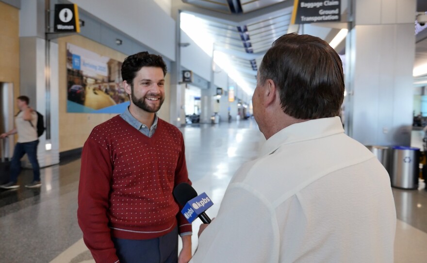 San Diego International Airport Arts Curator Daniel Dennert is shown being interviewed by KPBS reporter John Carroll on April 29, 2024.