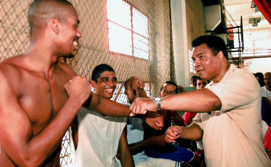 Ali spars with a Cuban amateur boxer on Sept. 10, 1998, during his visit to the Cerro Pelado sport complex in Havana. Ali was on a three-day visit to Cuba to deliver a $1.2 million donation in humanitarian aid to local hospitals.