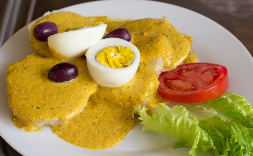 Ocopa is a traditional Andes dish made with slices of potato topped with a nutty, creamy sauce, hard boiled eggs and olives.
