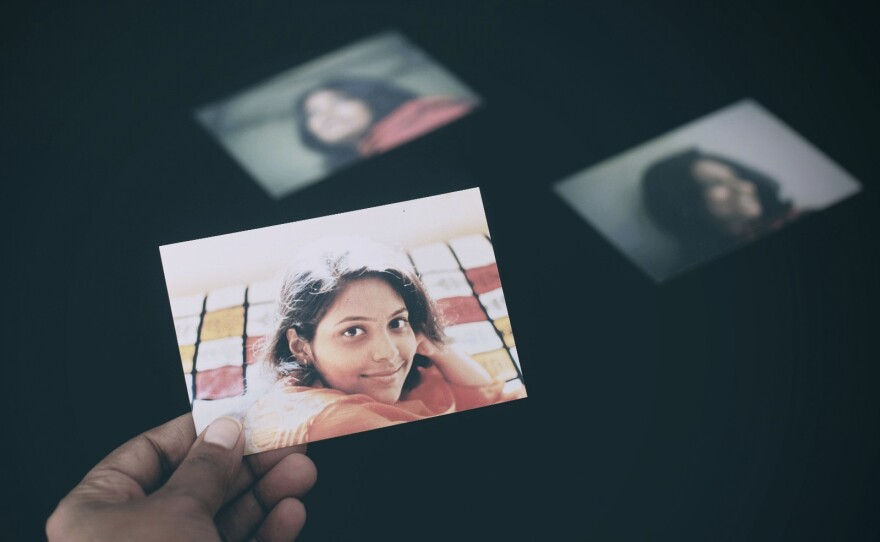 Neeta Satam looks at her portraits captured before she left India for America.