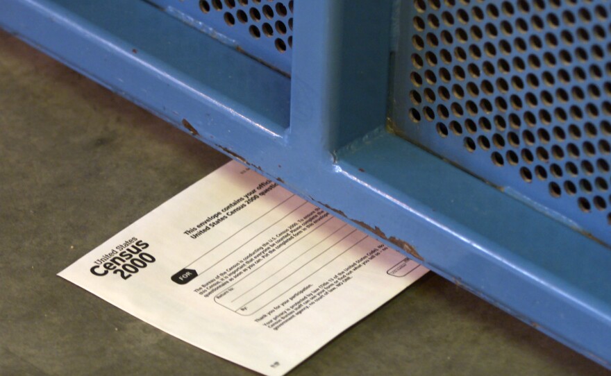 A 2000 census form sits under a cell door at the California State Prison, Los Angeles County in Lancaster, Calif. The federal government has considered incarcerated people residents of where they're incarcerated since the first U.S. census in 1790.