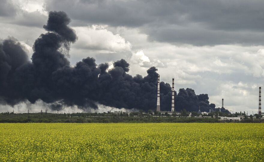 Smoke rises after an attack on an oil refinery in the Donbas region of eastern Ukraine on Sunday.