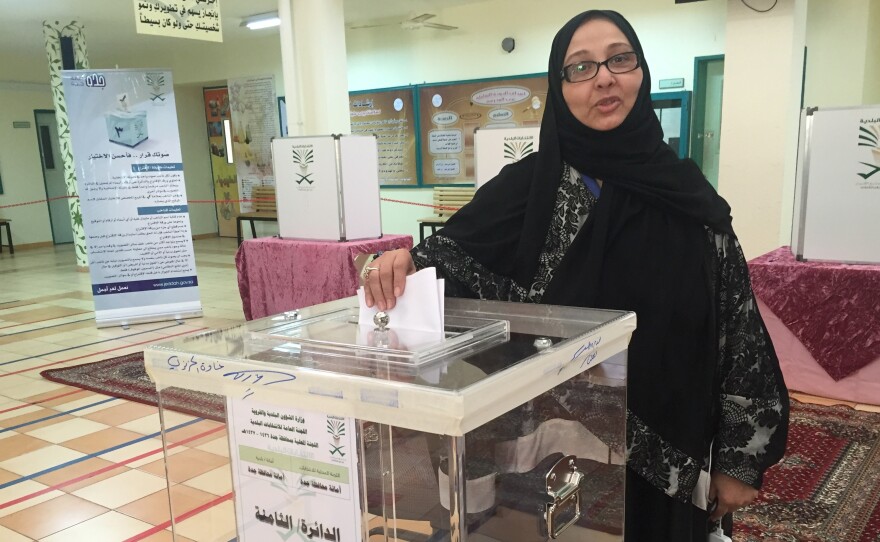Candidate Sameera abu al-Shamat votes in Saudi Arabia's municipal elections on Saturday. This was the first time Saudi women were allowed to vote, and women won 20 of 2,000 positions in municipal elections. Shamat did not win a seat. Many women called it a step forward, but said they still face many obstacles in the kingdom.
