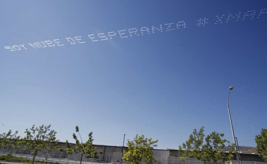 The artist Marcos Erre Ramírez had the words "Soy Nube De Esperanza," or "I Am A Cloud Of Hope," flown over the Otay Mesa Detention Center in San Diego near the U.S. border with Mexico.