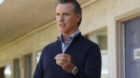 California Gov. Gavin Newsom gives an update on the state's initiative to provide housing for homeless Californians to help stem the coronavirus, during a visit to a Motel 6 participating in the program in Pittsburg, Calif., June 30, 2020.