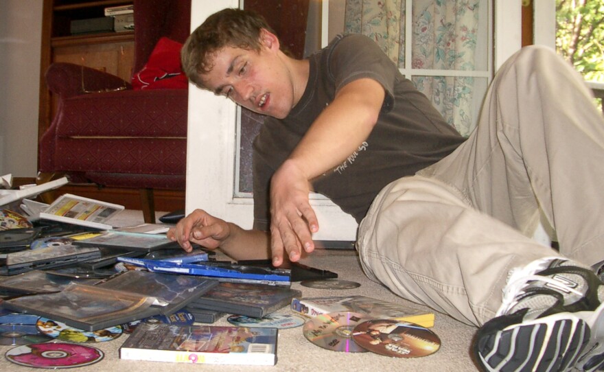 Andy in September 2010, before he began the new medication. He used to spend hours packing and unpacking videotapes and DVDs, especially when he was upset. His mother says he does that much less now.