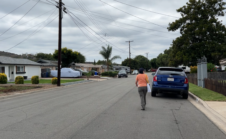 Andi McNew with the San Diego County Democratic Party knocks on doors in Poway support of Prop 50.
