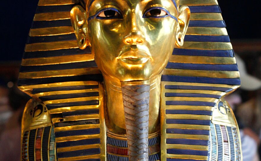 The golden mask of Tutankhamen is displayed at the Egyptian Museum in Cairo. New research suggests that the famous pharaoh suffered from numerous ailments, and probably spent much of his life in pain before dying at 19 from the combined effects of malaria and a broken leg.