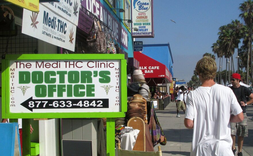 Signs like this are beginning to crowd the Venice Beach Boardwalk, but you may not want to get your annual physical here.