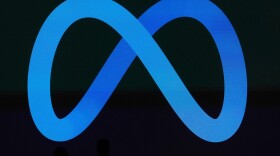 A Meta logo is shown on a video screen at LlamaCon 2025, an AI developer conference, in Menlo Park, Calif., April 29, 2025.