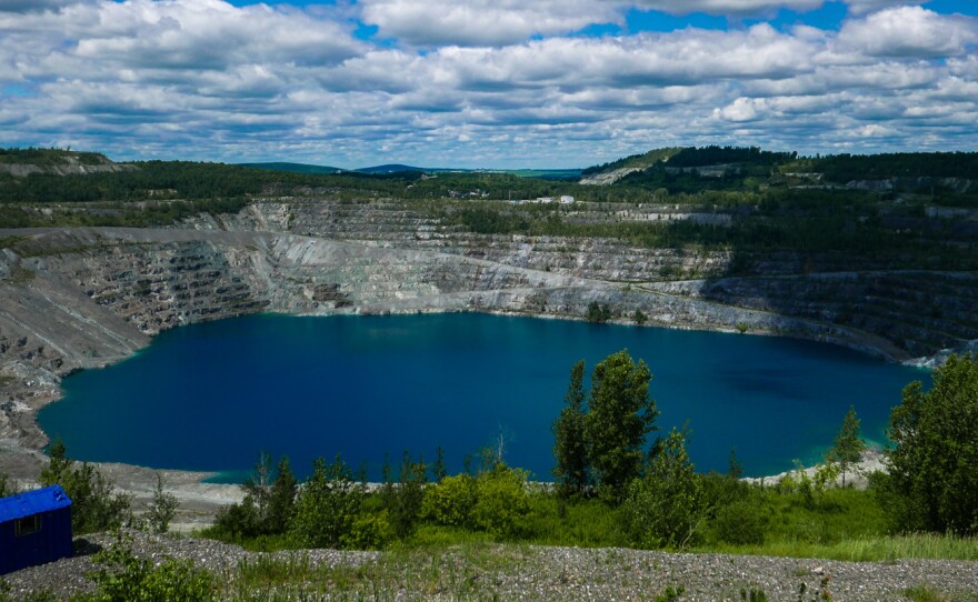 A photo taken in July shows what's left of the Jeffrey asbestos mine in Asbestos, Quebec. The town has voted to change its name to Val-des-Sources.