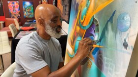 Artist Maxx Moses painting in his studio at Graffiti Gardens in Encanto. Nov. 17, 2025