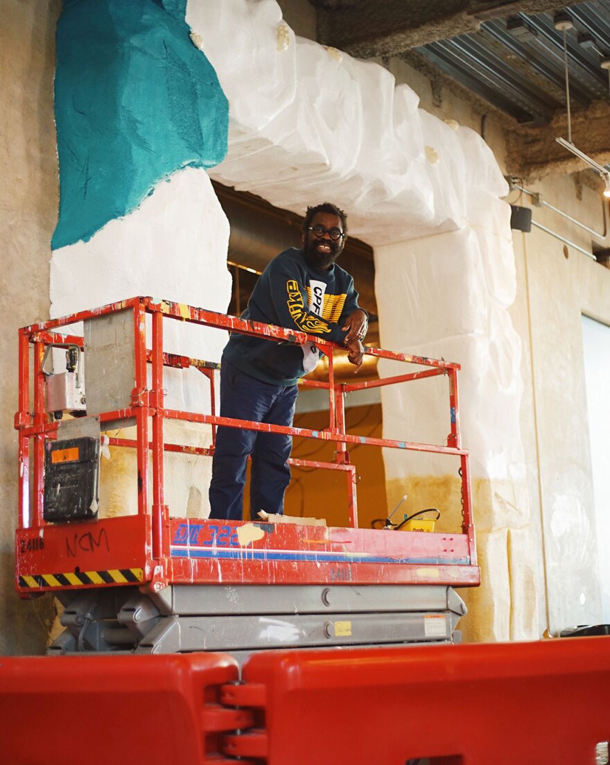 Swish Projects' John Itiola is shown installing "The Kids Run This Place" at the New Children's Museum in an undated photo.