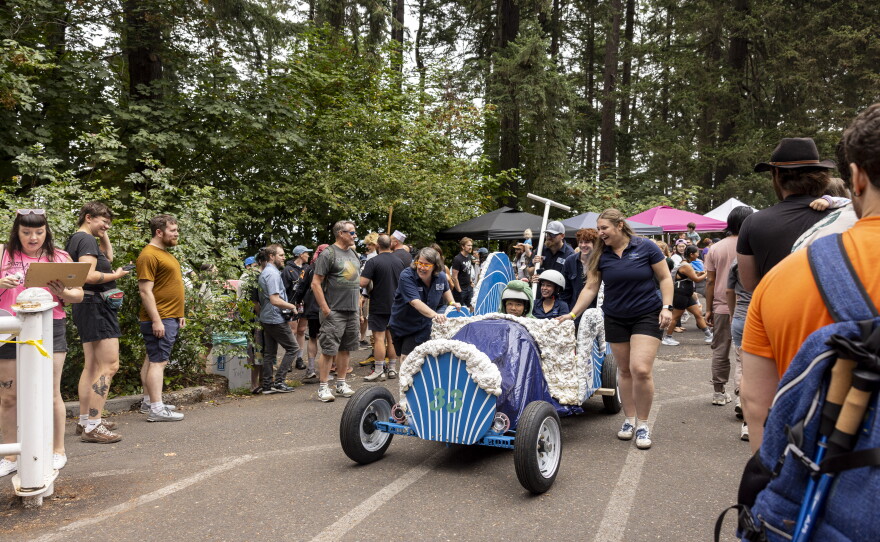 Team members at the Portland Adult Soapbox Derby guide their vehicles to the starting line on August 15, 2026 in Portland, Ore.
