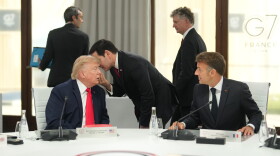 United States Secretary of State Marco Rubio, center, speaks with U.S. President Donald Trump, left, during a working session at the G7 summit in Evian-les-Bains, France, Tuesday, June 16, 2026.