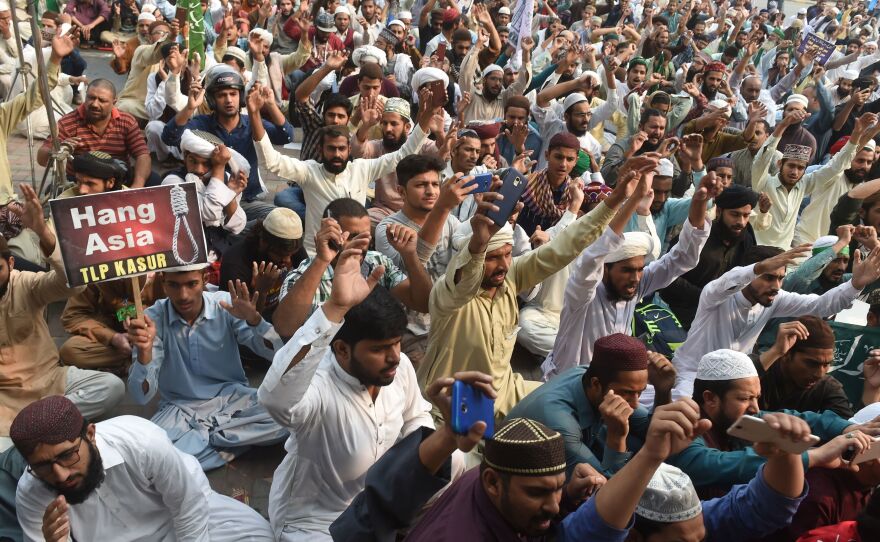 Supporters of Tehreek-e-Labaik Pakistan (TLP), a hardline religious political party chant slogans during a protest on Wednesday against the court decision to overturn the conviction of Asia Bibi.