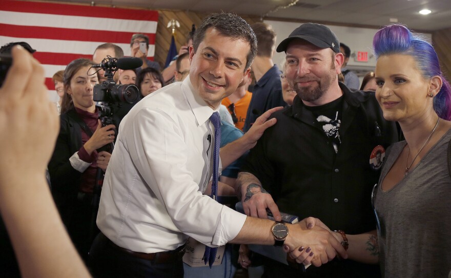 Democratic presidential candidate South Bend, Ind., Mayor Pete Buttigieg poses for a photo with New Hampshire voters after a town hall in Manchester, N.H.