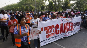 Hundreds of people gather in Abuja, the capital of Nigeria, to mark World Cancer Day on February 7, marching to raise awareness about cancer and the importance of early diagnosis. The World Health Organization cites Nigeria as a country with a rapidly rising number of cancer cases.