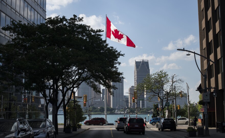 Canada legalized recreational marijuana in this month, but Canadians can find themselves barred from entering the U.S. if they say they've used it. A Canadian flag flies in Windsor, Ontario, in June, with the Detroit skyline visible behind it.