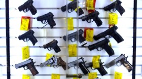 A study estimates that 32 million children live in homes with firearms, and a significant portion of those guns are not stored safely. Here, handguns are displayed at Kittery Trading Post, in Kittery, Maine.