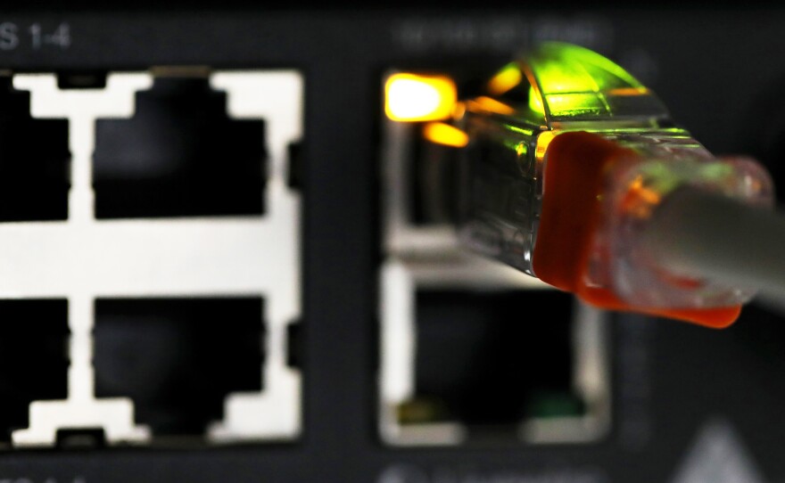An ethernet cable connects a router device inside a communications room at an office in London on May 15, 2017.