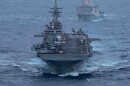 Wasp-class amphibious assault ship USS Boxer (LHD 4), front, and San Antonio-class amphibious transport dock ship USS Portland (LPD-27), sail in formation in the U.S. Central Command area of responsibility, June 30, 2026.