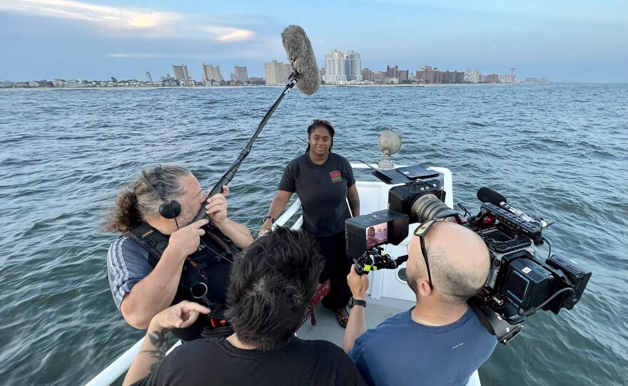 Tanasia Swift, Field Station Program Manager of the Billion Oyster Project being filmed on the Hudson River, New York City.