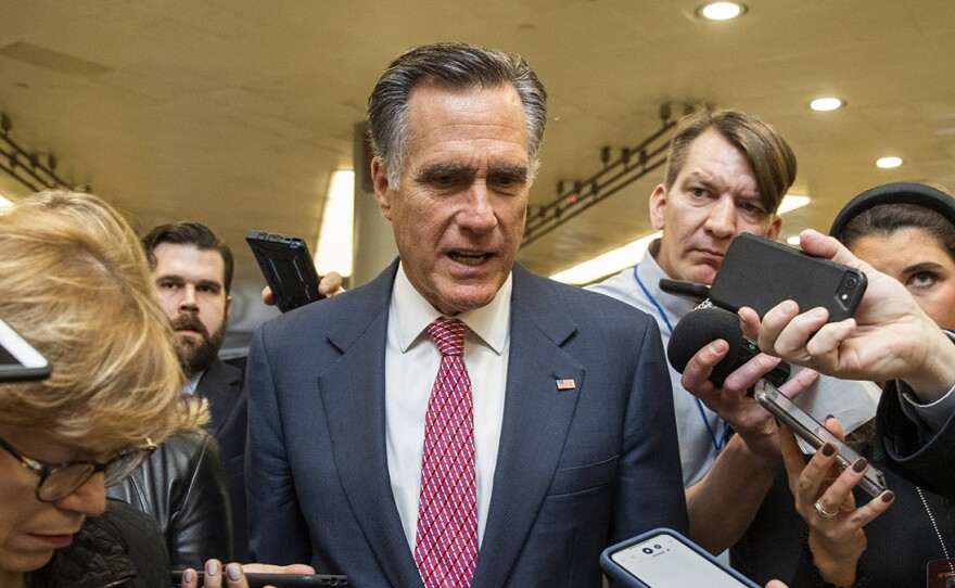 Sen. Mitt Romney, R-Utah, speaks to reporters as he arrives at the Capitol. On Wednesday, he became the first senator to vote to convict and remove a U.S. president of the same party.