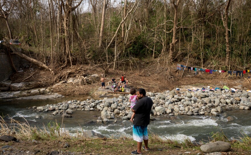 In the Calabaza River, local residents are bringing laundry in buckets to wash on the banks, drying their clothes on rocks or makeshift lines. Other people hop in to bathe.