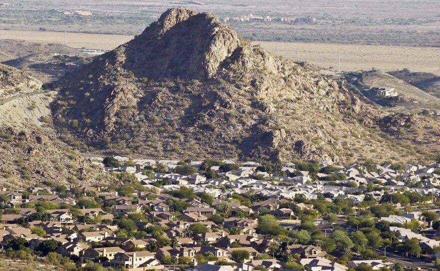 A housing development sits nestled in the South Mountain foothills in the Ahwatukee neighborhood in Phoenix. The city saw the biggest jump in population in the U.S. between 2017 and 2018.