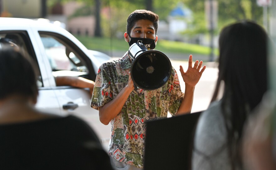 University of Kansas undergraduate Marc Veloz speaks at an environmental rally outside Lawrence city hall. He says his interest in activism was driven by concern over the disproportionate effect climate change had on communities of color in his hometown of Dallas.