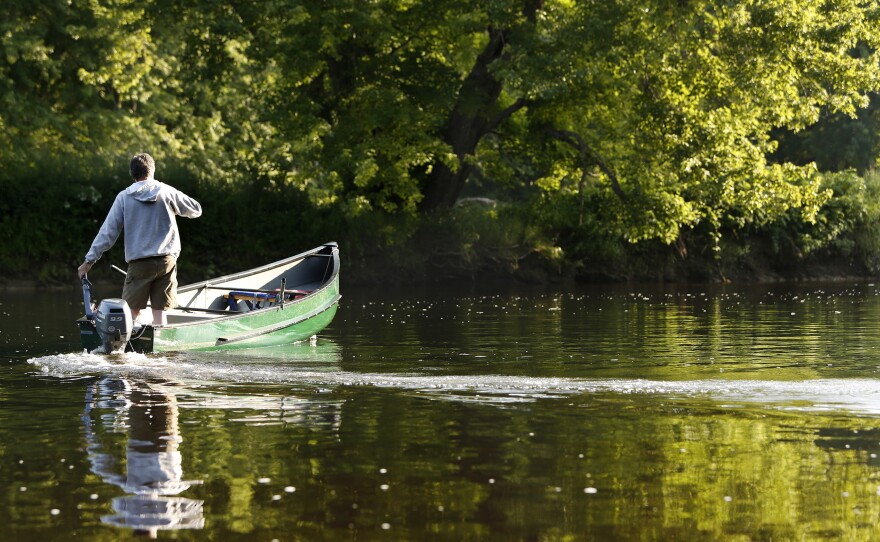 Mark Adams, a recreation manager for Katahdin Woods & Waters Recreation Area, motors down the East Branch of the Penobscot River after dropping hikers off at Big Seboeis River campsite in 2014.