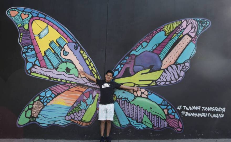 Luna Guzmán stands in front of a mural in Tijuana. As a child, she often dressed up as a butterfly. In detention, she said she felt like a “butterfly with its wings cut off.”