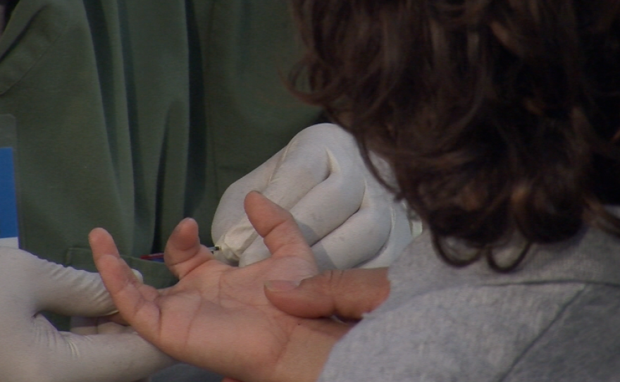 A child gets tested for lead poisoning at King-Chavez Primary Academy