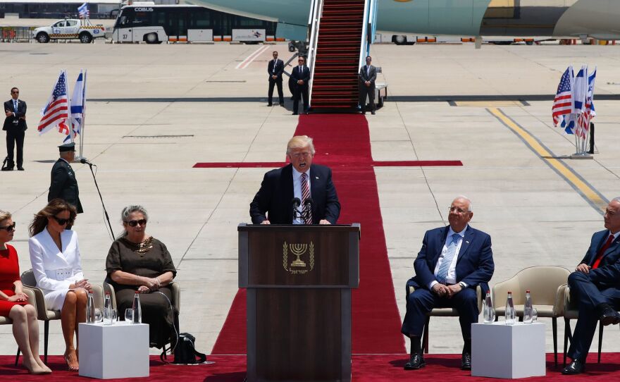 President Trump speaks at a welcome ceremony at Ben Gurion International Airport in Tel Aviv, Israel, on Monday, as Sara Netanyahu (from left), Melania Trump, Nechama Rivlin, Israeli President Reuven Rivlin and Israeli Prime Minister Benjamin Netanyahu listen.