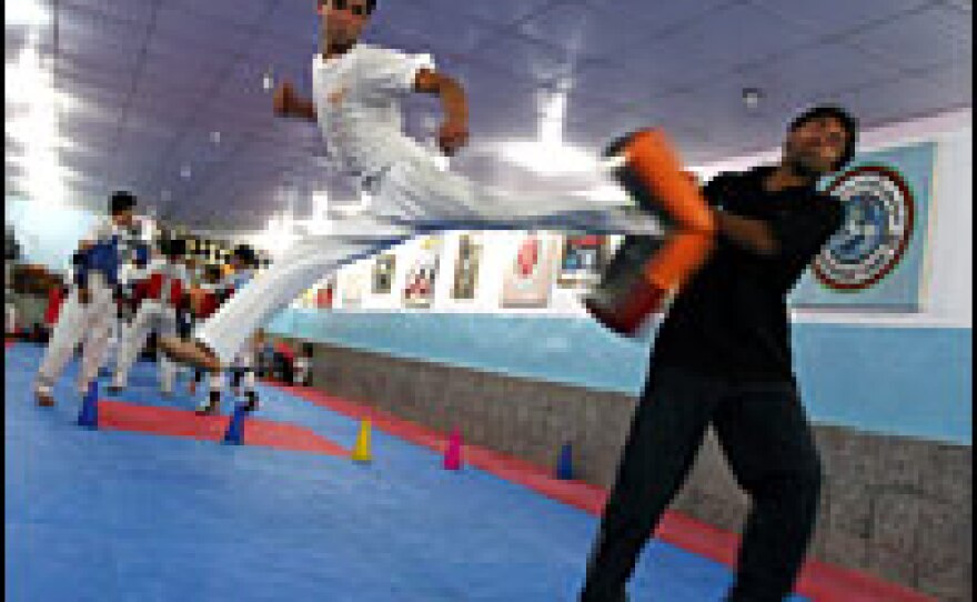 Nisar Ahmad Bahawe, 23, hopes to win a medal in tae kwon do for Afghanistan at the Beijing Olympics. He has been training and competing in the sport since he was 12.