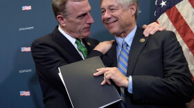 Rep. Tim Murphy, R-Pa., embraces Rep. Fred Upton, R-Mich., during a media briefing about the 21st Century Cures Act on Capitol Hill on Nov. 30.