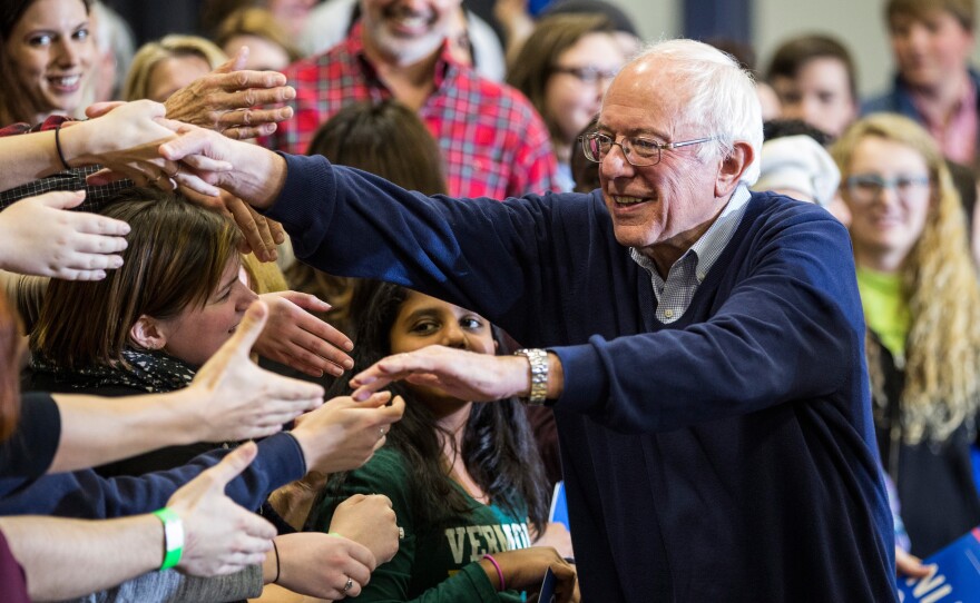 Sen. Bernie Sanders shakes hands with audience members after speaking at a campaign rally in Portsmouth, N.H.