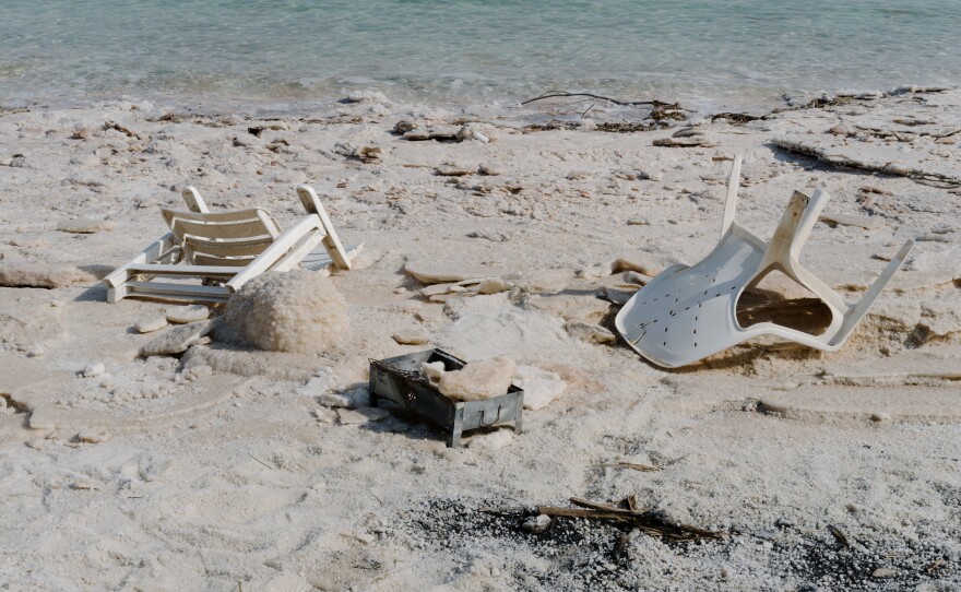 Plastic chairs and a mini barbecue abandoned on the shoreline of a permanently closed beach along the Dead Sea on Nov. 5.