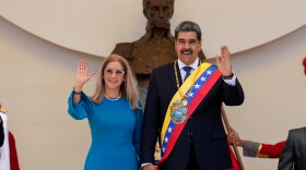 FILE - Venezuelan President Nicolas Maduro and his wife Cilia Flores wave after his swearing-in ceremony for a third term at the National Assembly in Caracas, Venezuela, on Jan. 10, 2025.
