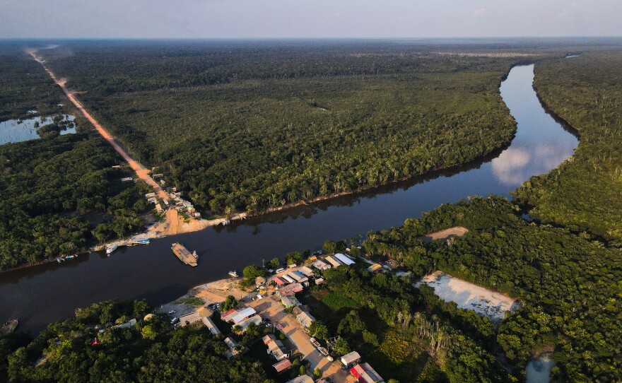 An aerial view of the BR-319 highway where it meets the Igapó Açu River in São Sebastião, Brazil, on Sept. 24. The community is a stopping point for travelers and tourists.