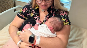 Maija Whitefeather-Manning, 28, cuddles her newborn baby, Corvus, at United Hospital District in Blue Earth, Minnesota- the only hospital in the region.