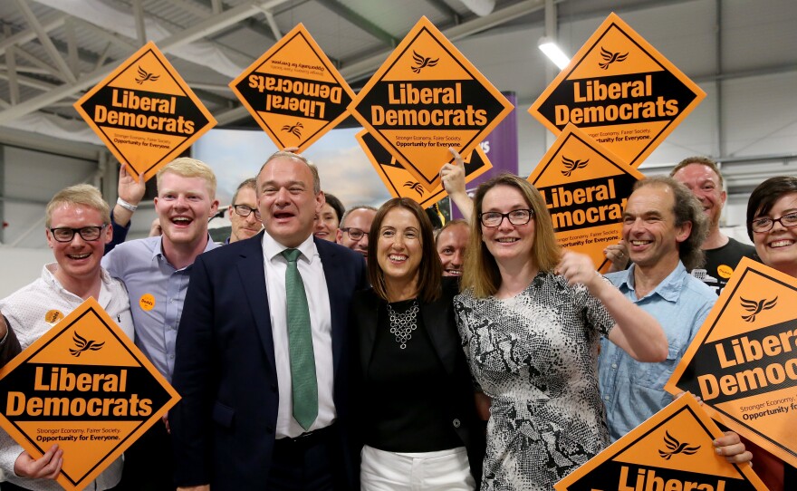 Liberal Democrat candidate Jane Dodds (center) celebrates her election victory with former Energy Secretary Ed Davey and Kirsty Williams, member of the Welsh Assembly, at Royal Welsh showground in Builth Wells, U.K., on Friday.