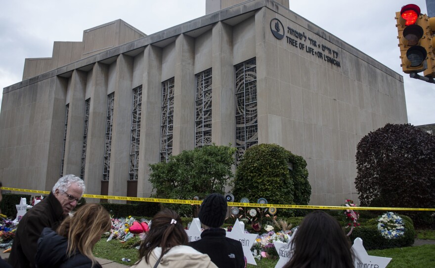 Members of Pittsburgh and the Squirrel Hill community pay their respects at the memorial to the 11 victims of the Tree of Life Synagogue massacre last Saturday.