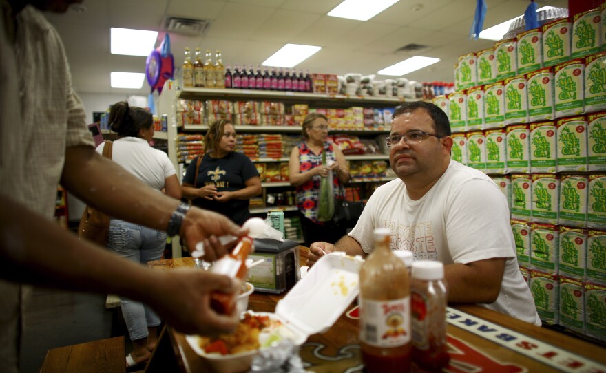 Jose Castillo, manager of Norma's Sweets Bakery, sits in the shop's dining area.