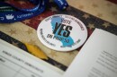 A button reads, “Vote Yes on Prop 50” at the Kings County Democrats booth during the Thursday Night Marketplace in downtown Hanford on Sept. 25, 2025. 