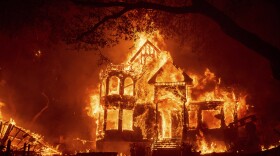 Flames from the Glass Fire consume the Glass Mountain Inn, late Sunday, Sept. 27, 2020, in St. Helena, Calif.