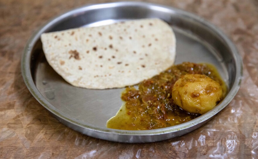 Salman's typical lunch: one piece of Indian bread and one curried potato.